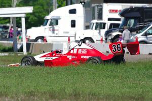 Steve Flaten's Formula X Star Formula Mazda spins off course at turn 13.