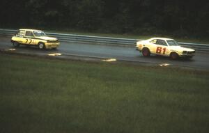 Tommy Archer's Renault LeCar chases H.Tide Ebding's Mazda RX-3 during the IMSA RS qualifying session.