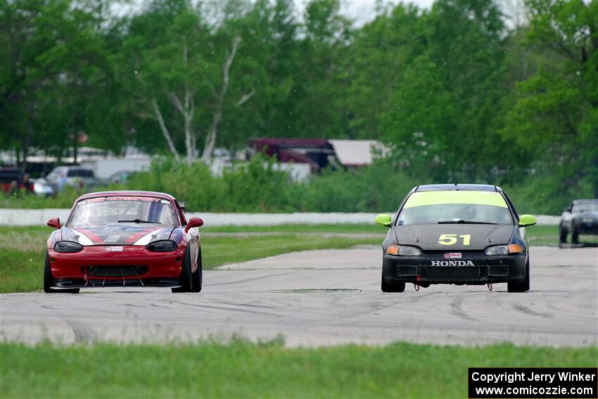 Wade Roggemann's ITJ Honda Civic passes John Elder's STL Mazda Miata