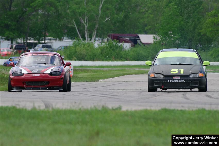 Wade Roggemann's ITJ Honda Civic passes John Elder's STL Mazda Miata