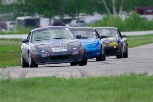 Aaron Jongbloedt's, Rick Buan's and Greg Youngdahl's Spec Miata Mazda Miatas