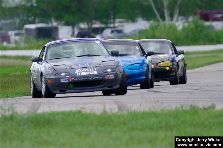 Aaron Jongbloedt's, Rick Buan's and Greg Youngdahl's Spec Miata Mazda Miatas