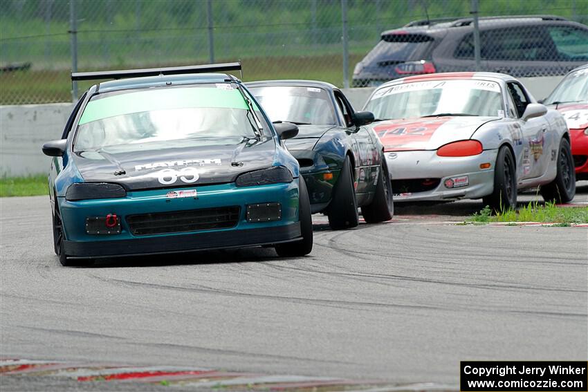 Mark Utecht's ITJ Honda Civic, Sam Nogosek's Spec Miata Mazda and Kyle Greenhill's Spec Miata Mazda Miata
