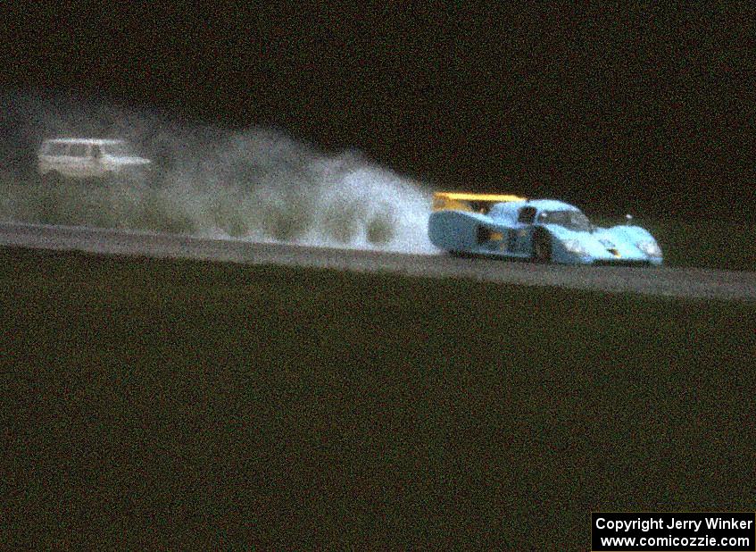 John Paul, Jr.'s Lola T-600/Chevy throws a plume of mist out the back down the Kinnard Straight.