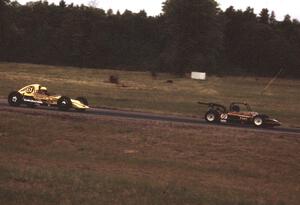 Dave Erickson's Lynx B Formula Vee chases Al Harhay's Red Devil F440 through turn 4.