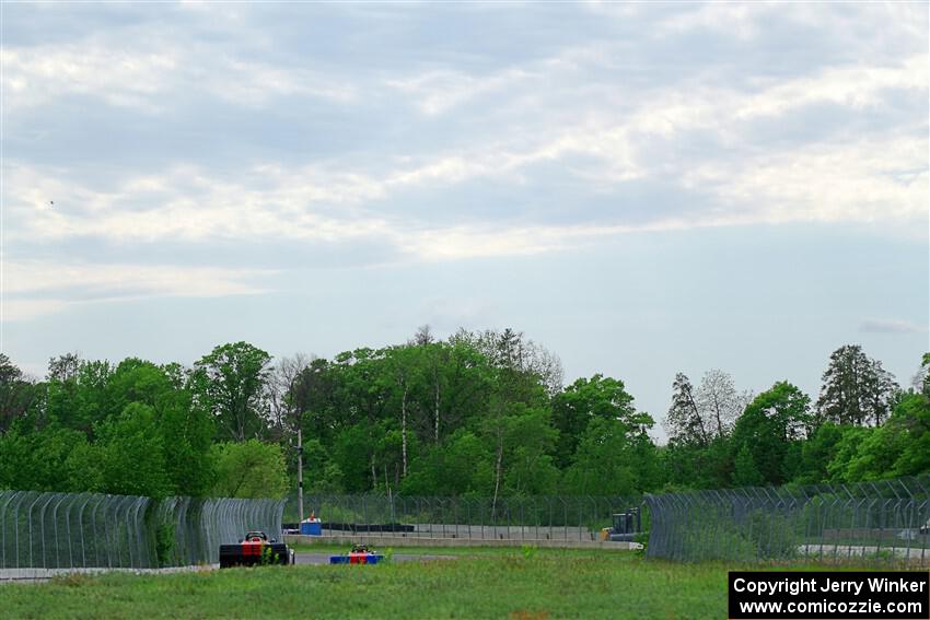 Several Spec Racer Ford 3s head into turns 7/8.