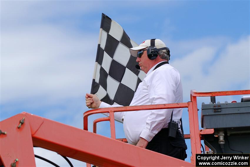 The checkered flag waves for the finish of the Spec Racer Ford 3 race.