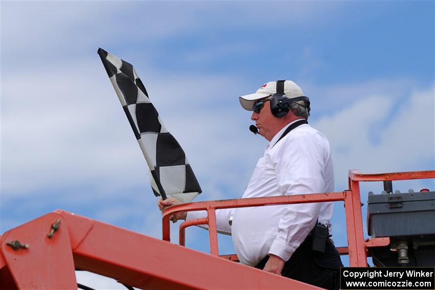 The checkered flag waves for the finish of the Spec Racer Ford 3 race.