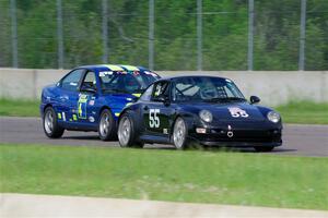 Phil Magney's ITE-1 Porsche 993 and John Glowaski's ITA Chrysler Neon ACR
