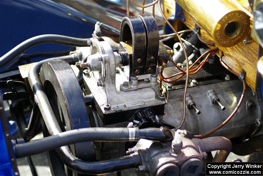 Engine bay of an antique car.