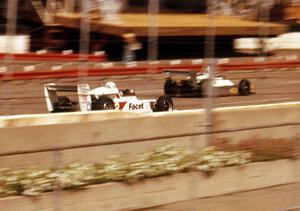 Dennis Firestone's March 79B passes a backmarker down the front straight on his way to the win.