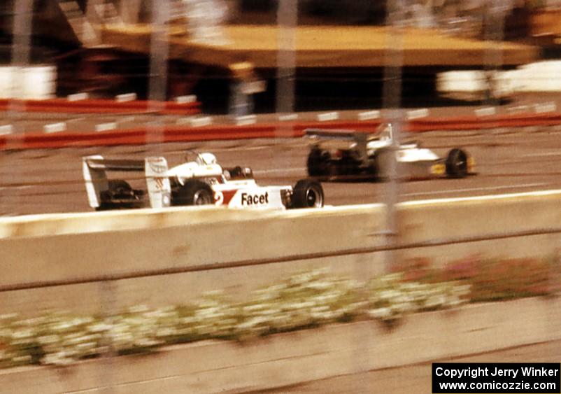 Dennis Firestone's March 79B passes a backmarker down the front straight on his way to the win.