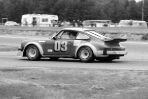 Werner Frank's Porsche 930 dives into the pits.