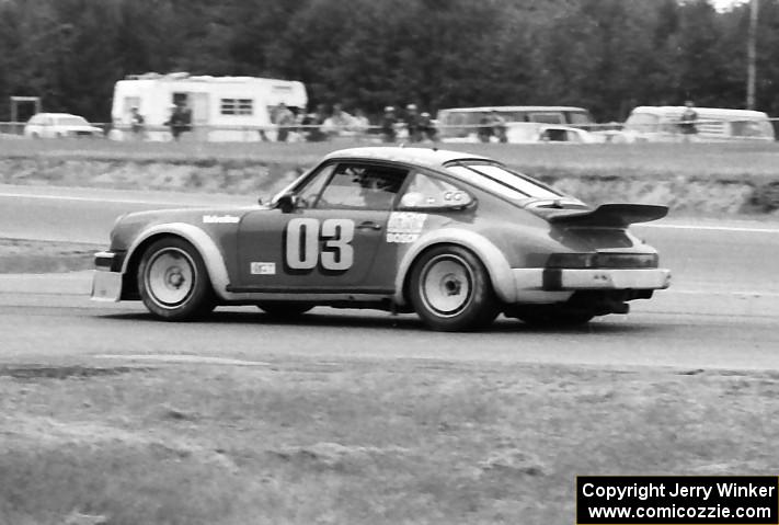 Werner Frank's Porsche 930 dives into the pits.