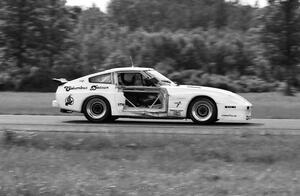 Logan Blackburn's Datsun 280ZX  sports damage to the right side early in the race.