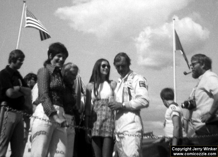 George Follmer is congratulated in the winner's circle.