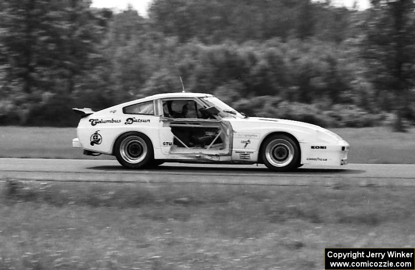 Logan Blackburn's Datsun 280ZX  sports damage to the right side early in the race.