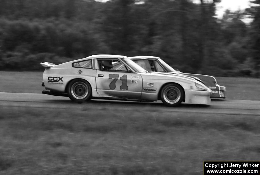 Charles Morgan's Datsun 280ZX and Bill Koll's Porsche 911 go side-by-side into turn four.