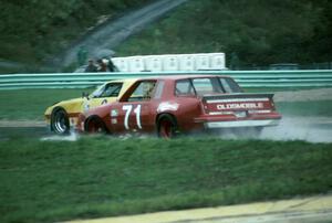 Paul Gentilozzi / Jack van Dyke - Oldsmobile Cutlass makes a pass on the Jerry Sarnatoro / Lynn Gregory - Chevy Camaro