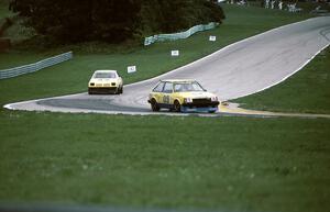 Frank Folino - Mazda GLC leads Jim Nealon - Dodge Charger (IMSA RS race)