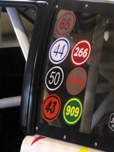 Tribute stickers to fallen rallyists on the Tayler Hoevenaar / Steven Stewart Subaru Forester.