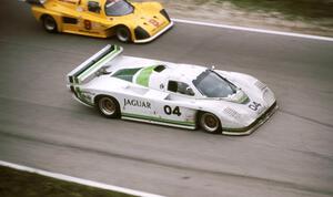 Brian Redman / Hurley Haywood - Jaguar XJR-5 passes the Frank Carney / Dick Davenport - Tiga GT285/Mazda