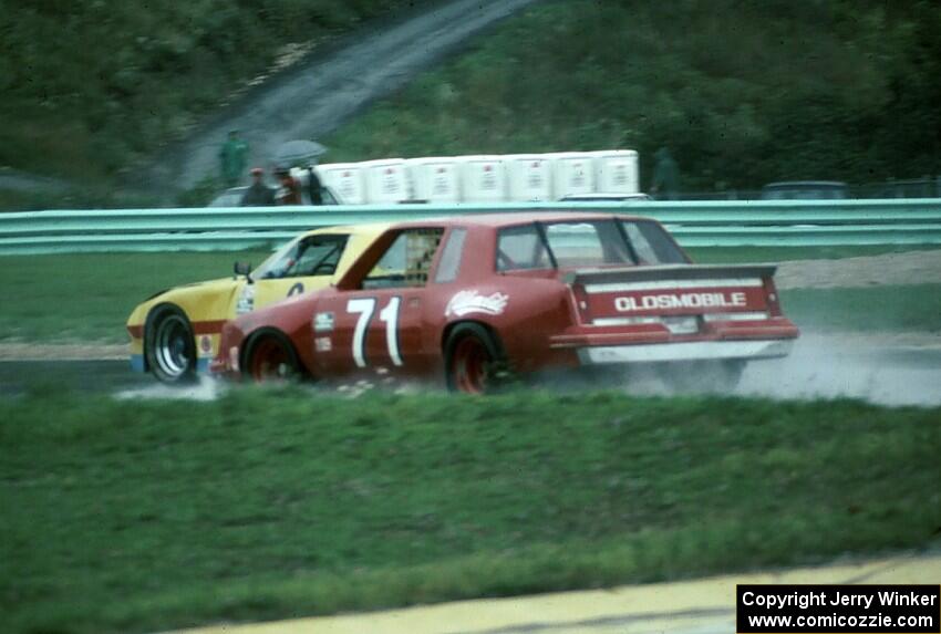 Paul Gentilozzi / Jack van Dyke - Oldsmobile Cutlass makes a pass on the Jerry Sarnatoro / Lynn Gregory - Chevy Camaro