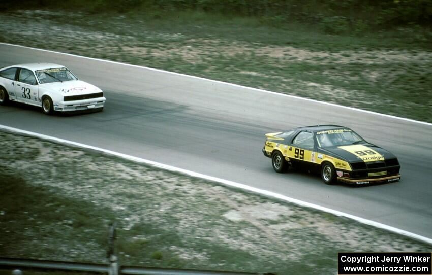 Kal Showket - Dodge Daytona leads Tommy Archer - Chevy Cavalier RS (IMSA RS race)