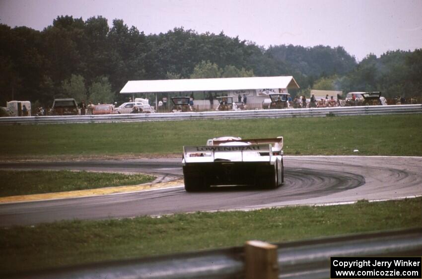 Drake Olson / Bobby Rahal - Porsche 962 is chased by the Al Holbert / Derek Bell - Porsche 962 through turn 8.