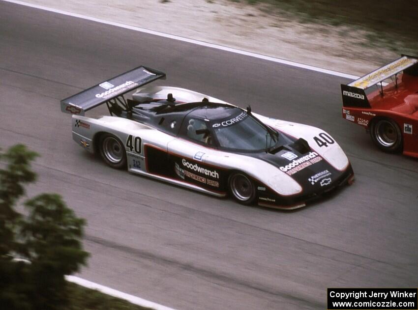 David Hobbs / Sarel van der Merwe - Chevrolet Corvette GTP make a pass on a camel Lights car exiting the carousel.