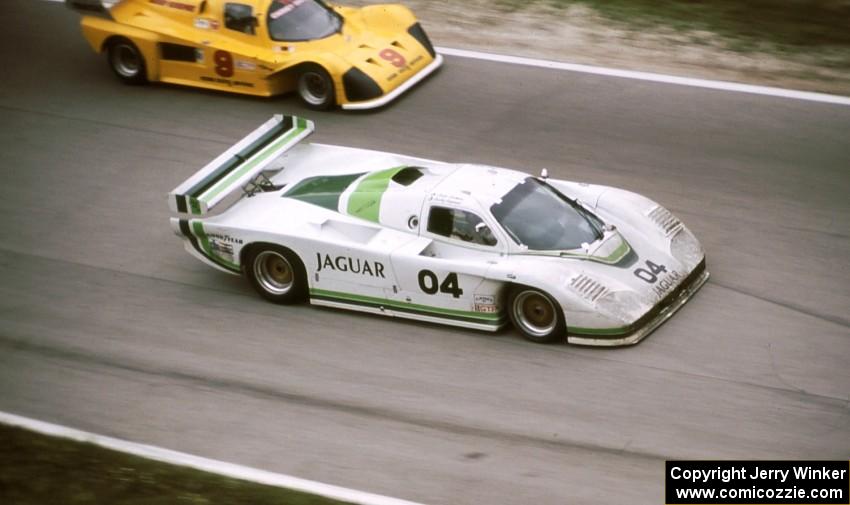 Brian Redman / Hurley Haywood - Jaguar XJR-5 passes the Frank Carney / Dick Davenport - Tiga GT285/Mazda