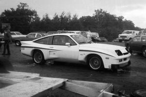 A Dekon Monza for the street roams the paddock area.