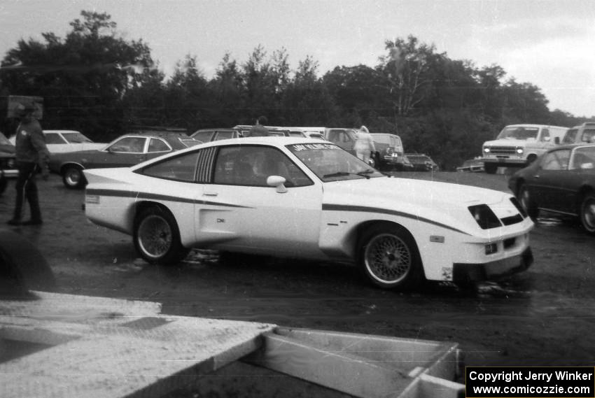 A Dekon Monza for the street roams the paddock area.