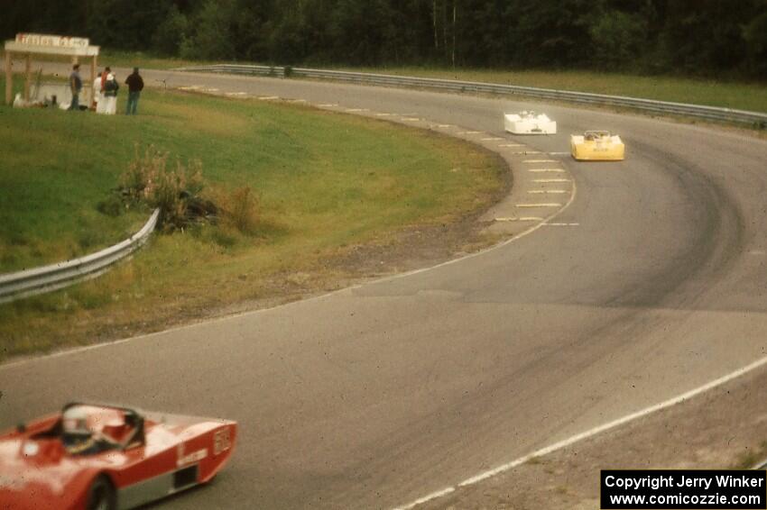 Syd Demovsky's Lola T-590 pulls away from Alan Lewis's Tiga SC80 and John Cahill's Ocelot in the Sports 2000 battle.