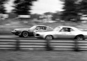 Al Mumaugh's Pontiac Trans-Am is passed by Al Ratcliff's Chevy Camaro.