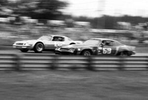The  Chevy Camaros of Jocko Maggiacomo (62) and Dennis Linker (68) battle early on.