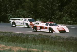 The Al Holbert / Jim Trueman March 83G/Porsche leads the Bob Tullius / Bill Adam Jaguar XJR-5 into turn 1 on lap 1.