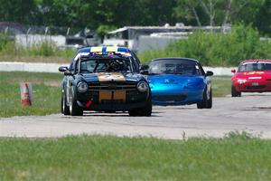 Bob Barton's F Production Triumph TR-6, John Glowaski's ITA Chrysler Neon ACR and Rick Buan's Spec Miata Mazda Miata
