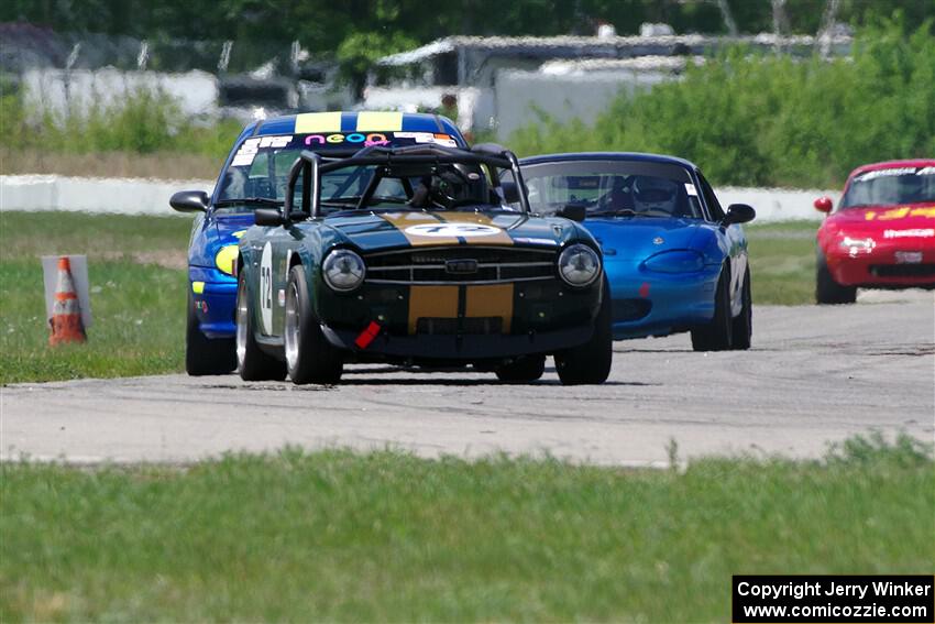 Bob Barton's F Production Triumph TR-6, John Glowaski's ITA Chrysler Neon ACR and Rick Buan's Spec Miata Mazda Miata