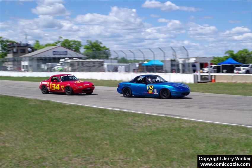 Rick Buan's Spec Miata Mazda Miata and Eric Chang's ITA Mazda Miata