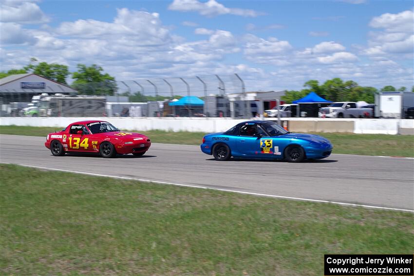 Rick Buan's Spec Miata Mazda Miata and Eric Chang's ITA Mazda Miata
