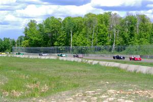 The Spec Racer Ford 3 field comes through turn 2 on the first lap.