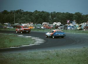 Ron Tambourine's Mazda RX-3 leads Ralph Schreyer's Mercury Capri II through turn 4.