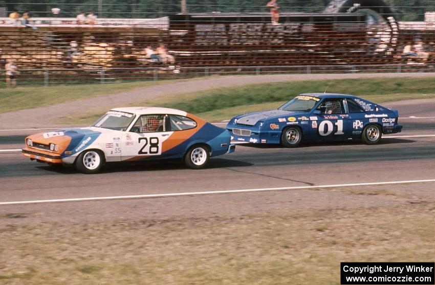 Ralph Schreyer's Mercury Capri II about to be passed by Joe Varde's Dodge Charger on the front straight.