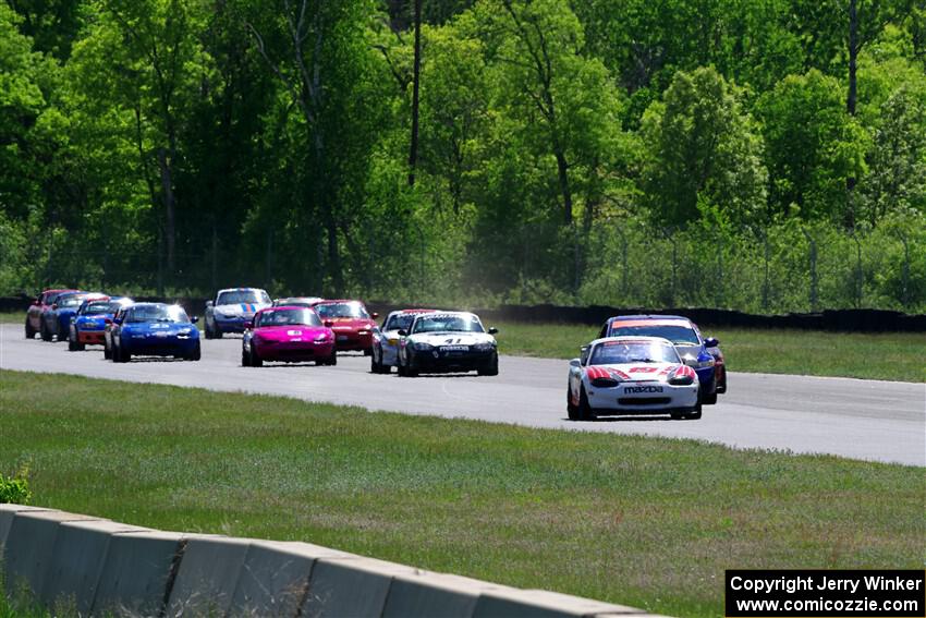 The small-bore field on the first lap of the race between turns 3 and 4.