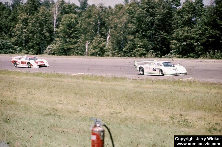 Bob Tullius/ Bill Adam Jaguar XJR-5 leads the Dave Cowart / Kenper Miller March 83G/Chevrolet through turn 1.