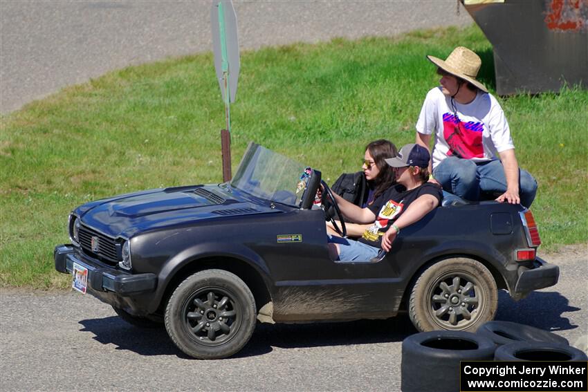 A shortened Honda Civic served as a pit vehicle for a team.