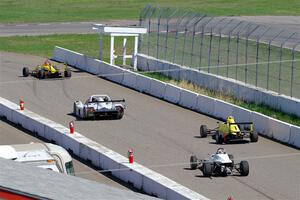 The Formula and Sports Racer group leaves pit lane on the pace lap.