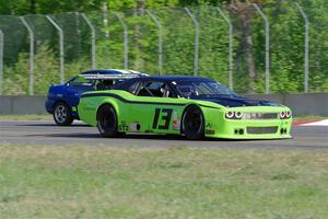 John Glowaski's ITA Chrysler Neon ACR and Robert May's GT-2 Dodge Challenger