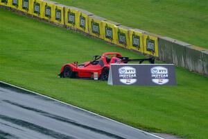 Seth Bacon's Radical SR3 XX 1340 spins off course a turn 6.